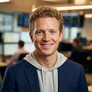 Foto del profilo di Ryan Brooks, identificato come Lead Trading Analyst di CardinQuota